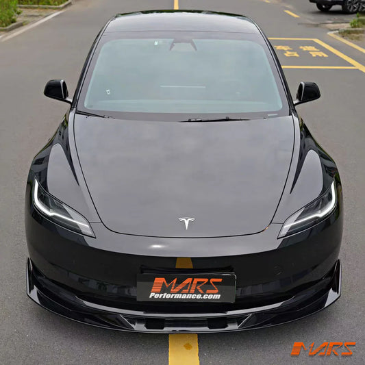 Black Tesla Model 3 with aftermarket front lip kit and aerodynamic EV mods by Mars Performance on road